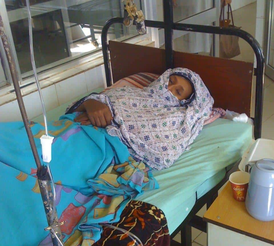 A fistula patient lies in a hospital bed in Sudan
